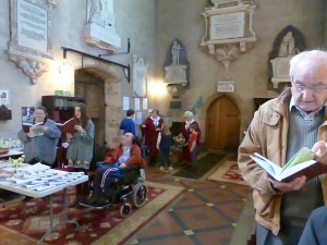 Some of the children prepare to hand out the posies of flowers to the ladies in the congregation