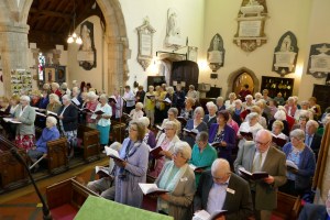 Congregation singing one of 17 hymns at the St Asaph Diocese MU 125th Anniversary Service at Guilsfield Church