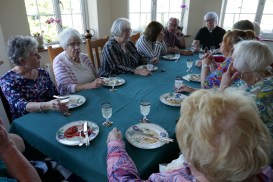 Guests chatting over starter around table